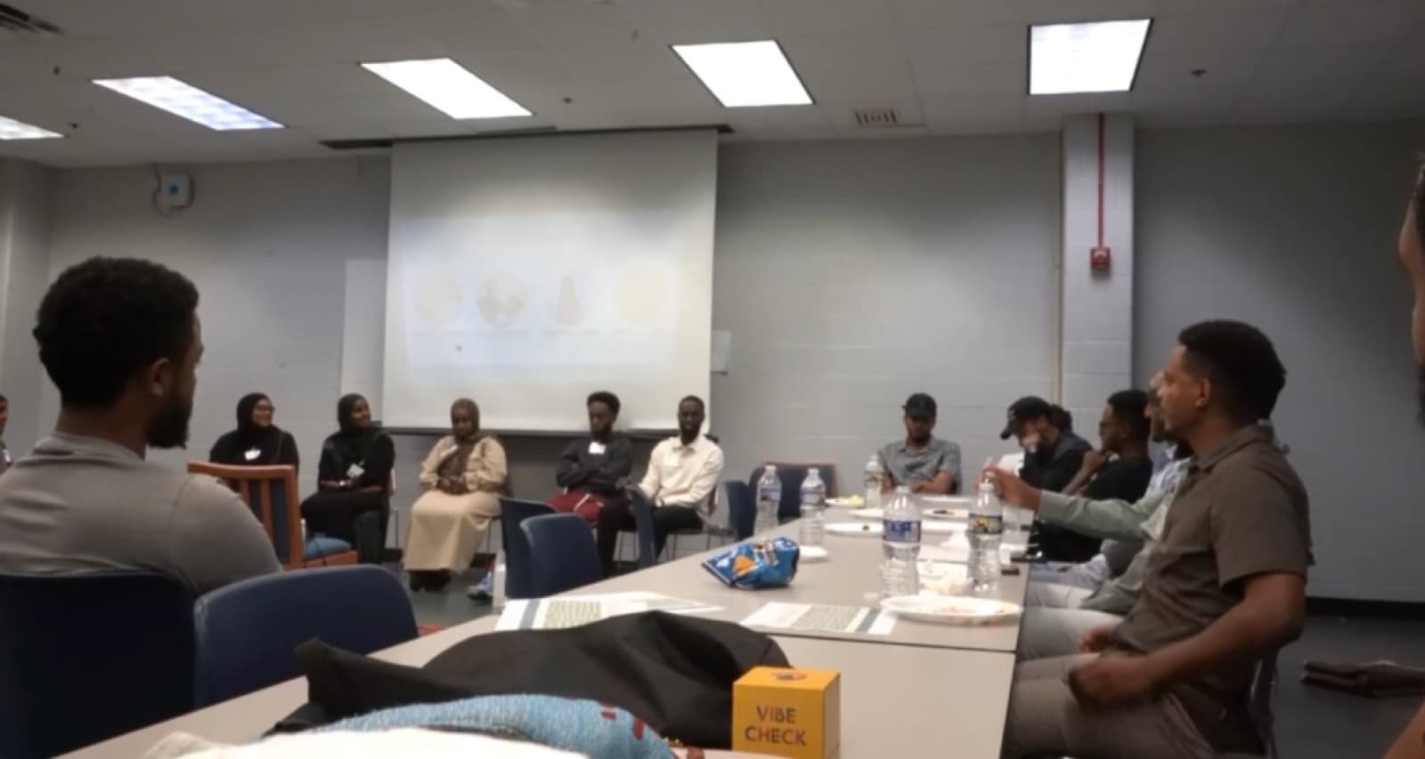 Youth workshop with a panel and participants seated around a table