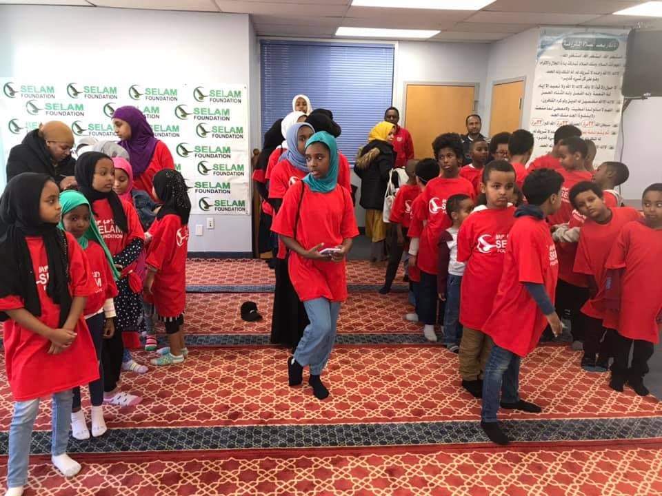 Children gathered in community prayer space